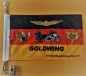 Preview: GOLDWING-Deutschland mit der Goldwing, den Goldwing Emblemen und Werbung, 40 x 28 cm. Unter Verwendung einer blickdichten Zwischenlage werden 2 Fahnen zu einer Fahne vernäht, dadurch wesentlich stabiler und wickelt sich nicht mehr so schnell um den Fahnen